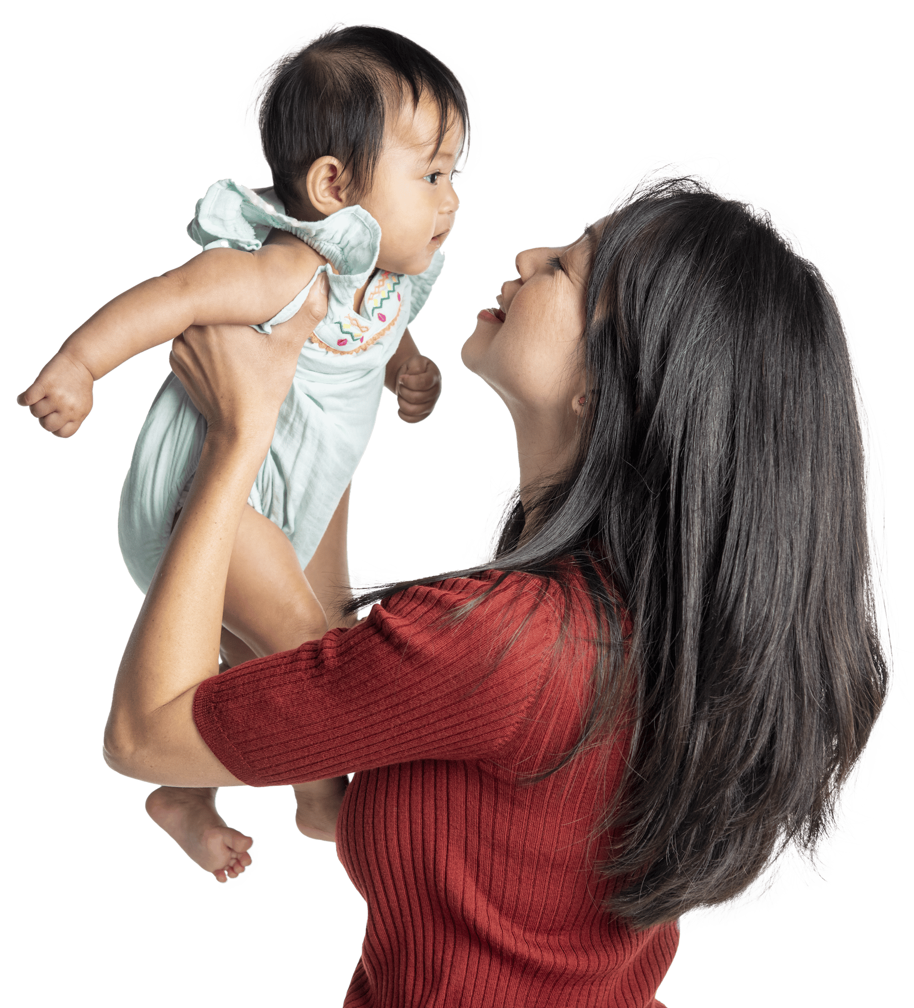 Asian woman holding her baby in her arms